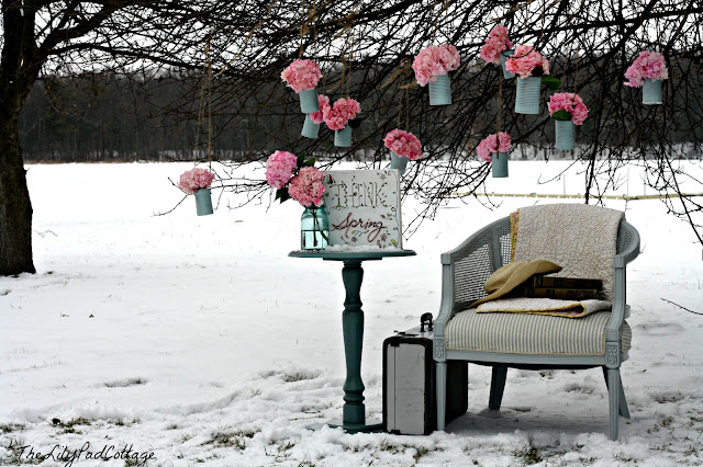 A bench covered in snow
