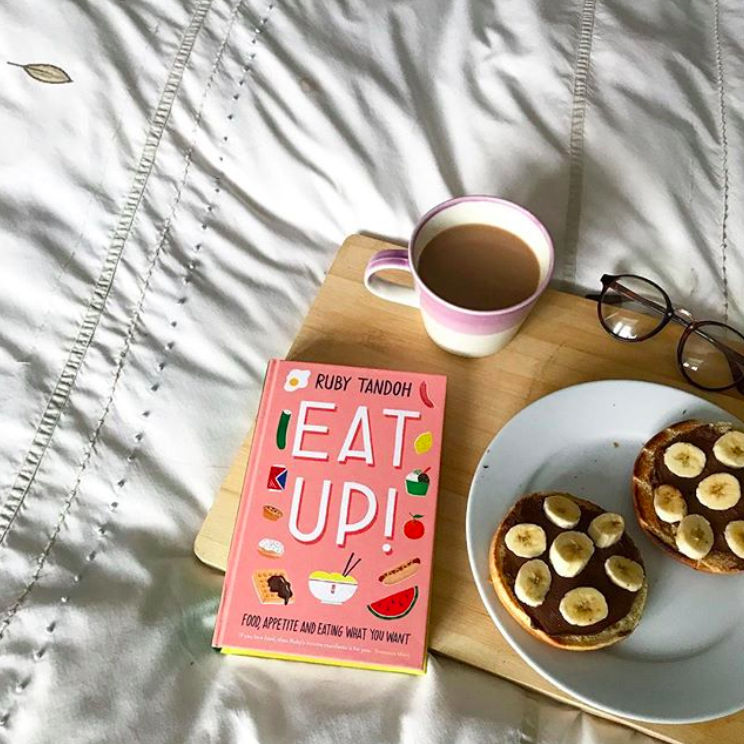 Eat Up book next to tea and toast