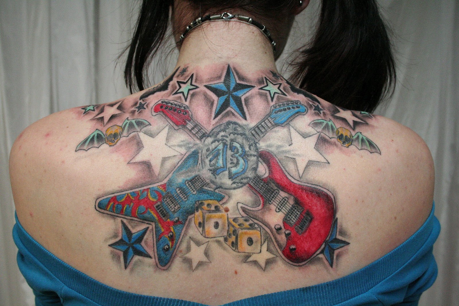 http://3.bp.blogspot.com/-W4tKrTY5IB4/UEd_Tr__NiI/AAAAAAAAAVI/XXMIoea8oC0/s1600/tattoos+for+girls-bodytribaltattoos.blogspot.com-New_School_Guitar_Stars_Tattoo_by_2Face_Tattoo.jpg
