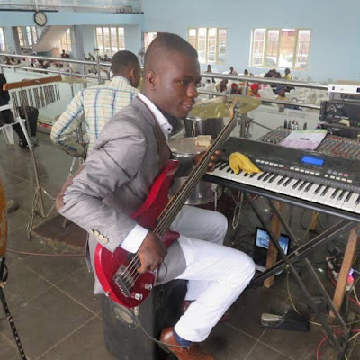 Nigerian bass guitarist playing okaka