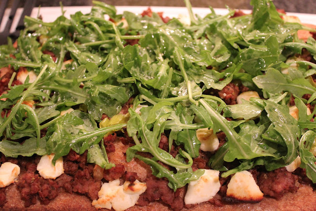 Lamb pizza with peppers and arugula