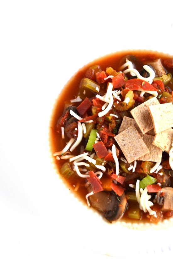This easy pizza soup recipe combines all of your favorite pizza flavors in one bowl for a healthy and hearty meal! www.nutritionistreviews.com
