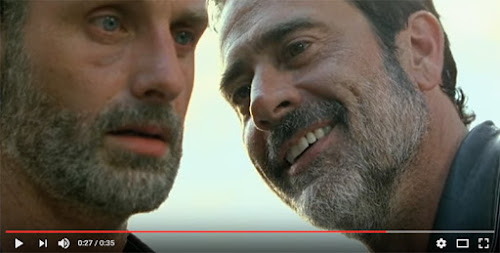 Rick looking to be in shock as Negan looks on with his evil smile