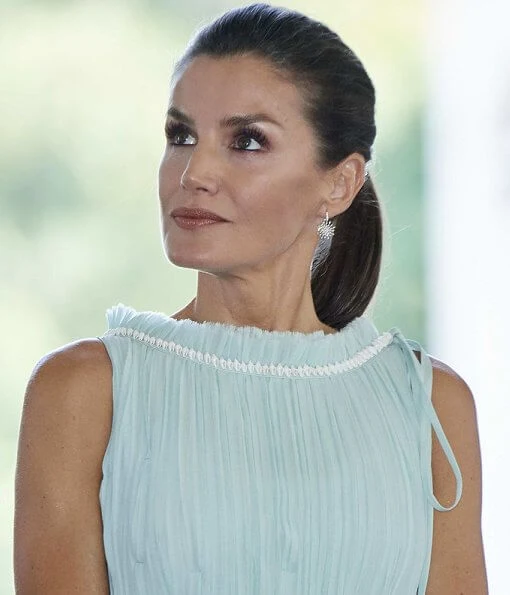 Queen Letizia wore Adolfo Dominguez embroidered cotton dress with belt. Letizia wore a new aquamarine blue midi dress