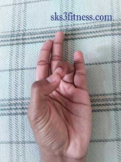 Hand is in Prithvi Mudra gesture for meditation