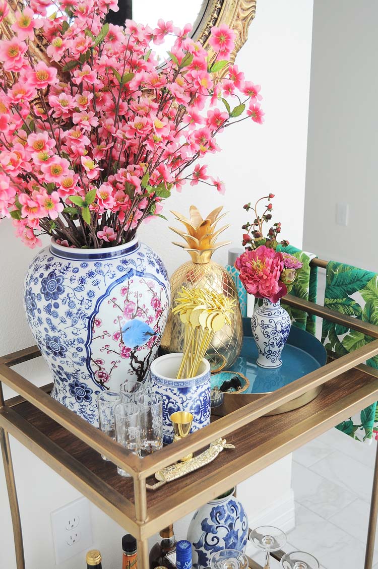 A blue and white with florals chinoiserie and ginger jar inspired bar cart styled for summer soirees and entertaining. So many decor ideas!