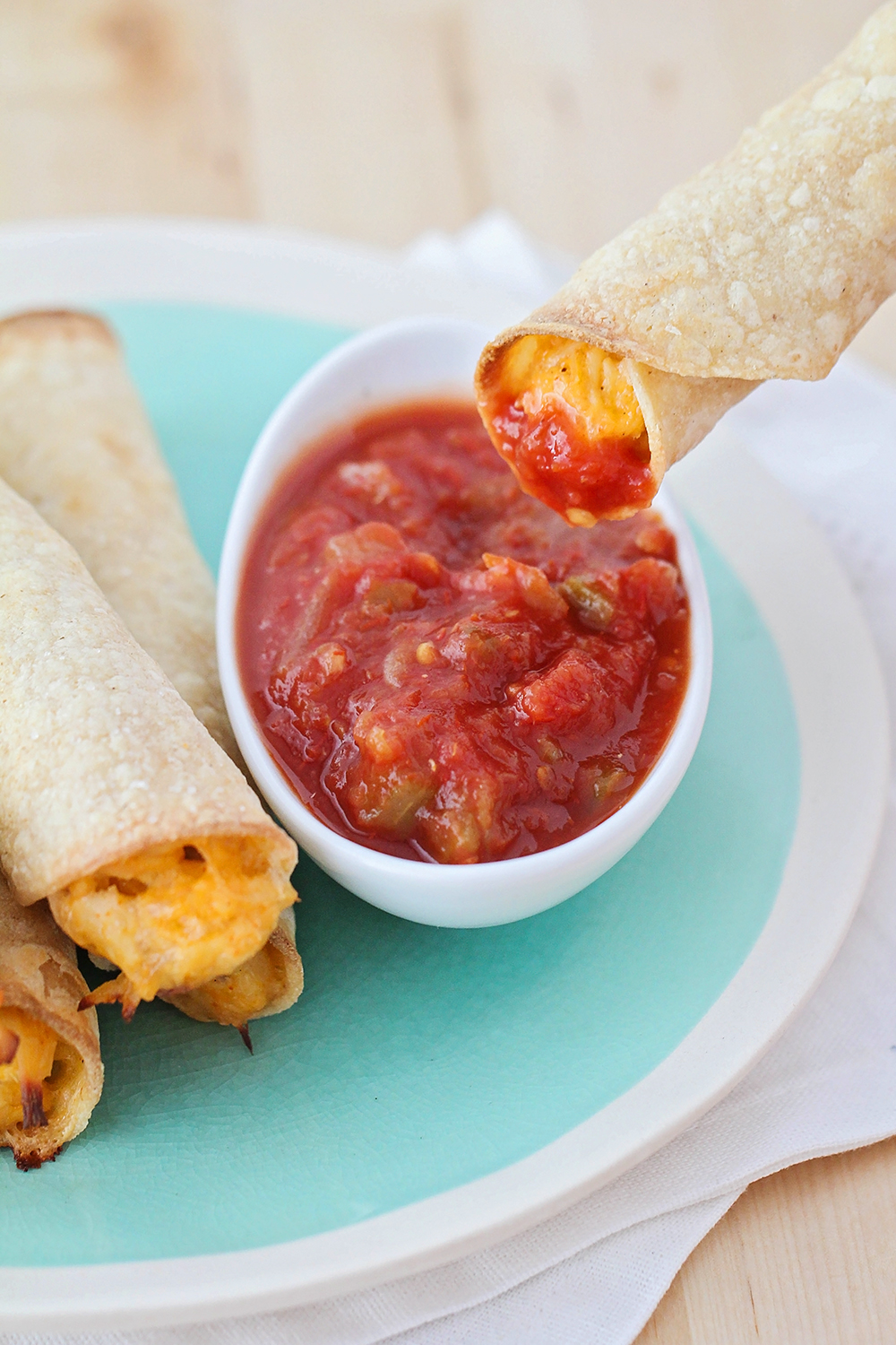 These simple and delicious baked creamy chicken taquitos take just a few minutes to make, and are the perfect quick lunch or snack!