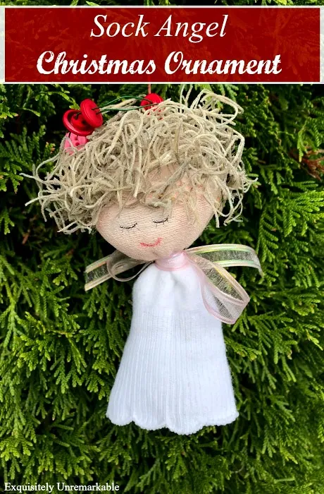 Sock angel ornament doll hanging on a Christmas Tree