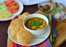 Club Kachori is a quite a famous weekend breakfast dish from the city of Kolkata. These are bite sized puri served with spicy potato curry. Find the recipe on www.jyotibabel.com