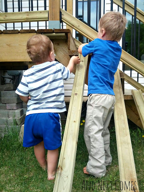 Kids playing with matchbox cars on DIY play car ramps