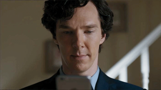 Sherlock looks at phone and smirks