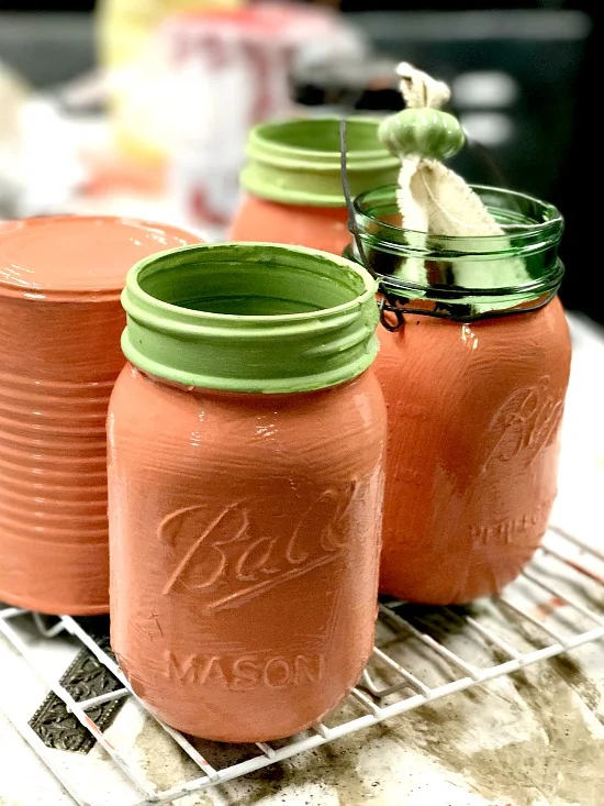 cans and mason jars painted orange