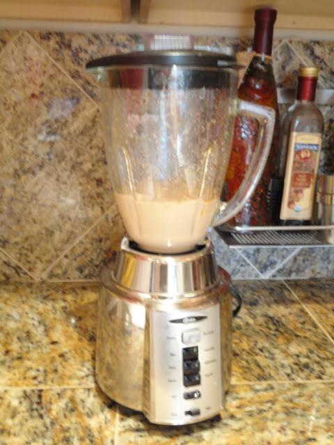 A blender with Olive Oil, Red Wine Vinegar, Worcestershire Sauce, Garlic, Honey, Italian Seasoning, Smoked Paprika, Granulated Garlic, Parmesan Cheese, Salt and Pepper blended until smooth.