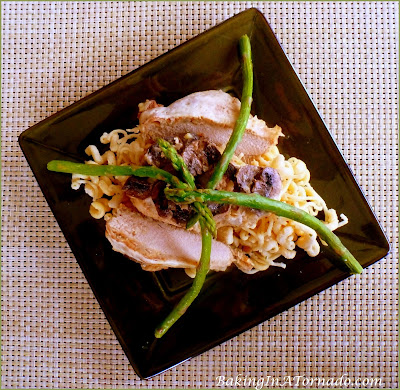Provolone Chicken with Mushrooms and Asparagus, a delicious dinner any night of the week. Easily prepared in one saucepan then baked in the oven. | Recipe developed by www.BakingInATornado.com | #recipe #dinner #chicken