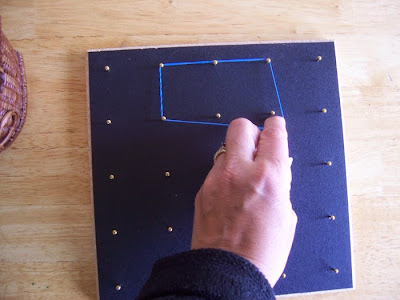 Lisa Nolan making a rectangle shape with a rubber band on the geoboard