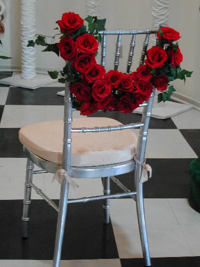 These wedding chair decorations can be attached to places of honor for the