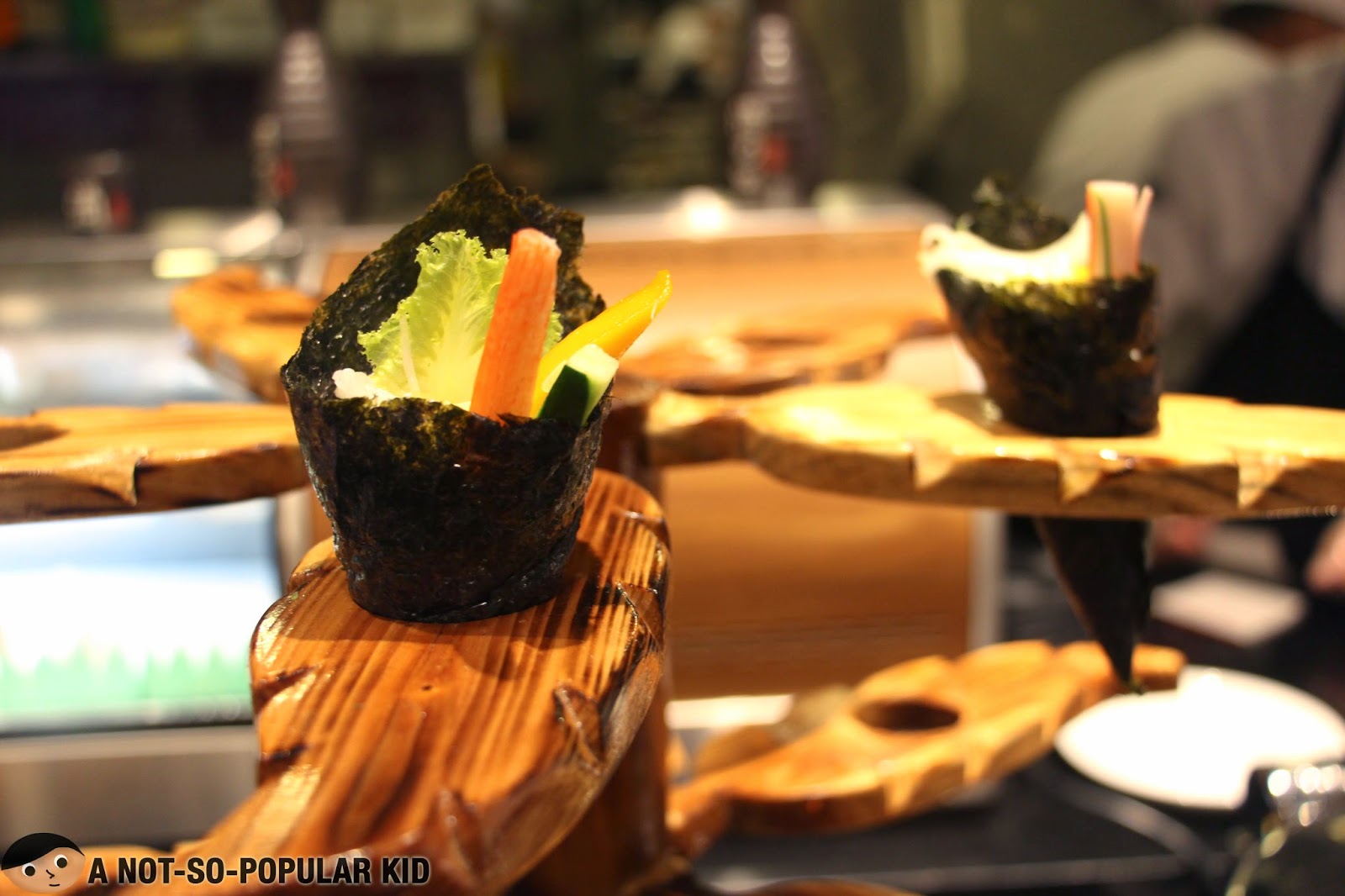Veggie, kani and mango wrapped in nori seaweed in Vikings