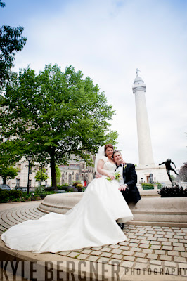 Bride and Groom in fron of the Washington Mounument in Mt. Vernon Square Baltimore