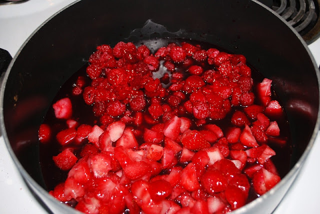 Add the berries to the large saucepan.