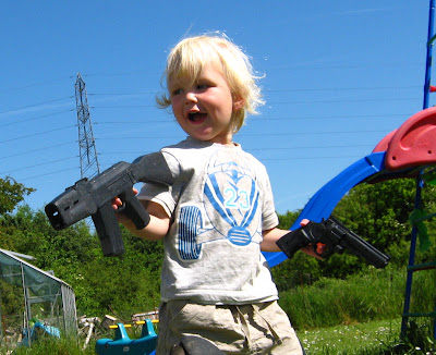 boy with toy guns