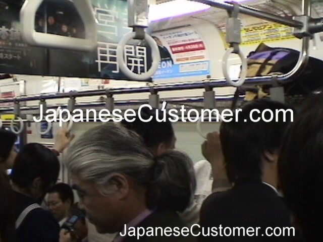Japanese Customers commuting Copyright Peter Hanami 2014