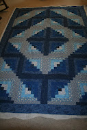 A traditional log cabin quilt.