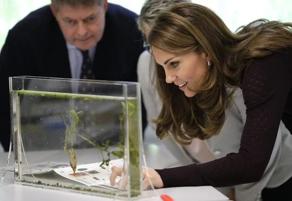 Kate Middleton wore a new high neck jumper by Warehouse and a new khaki culottes by Jigsaw. Chanel bag, Tod's shoes