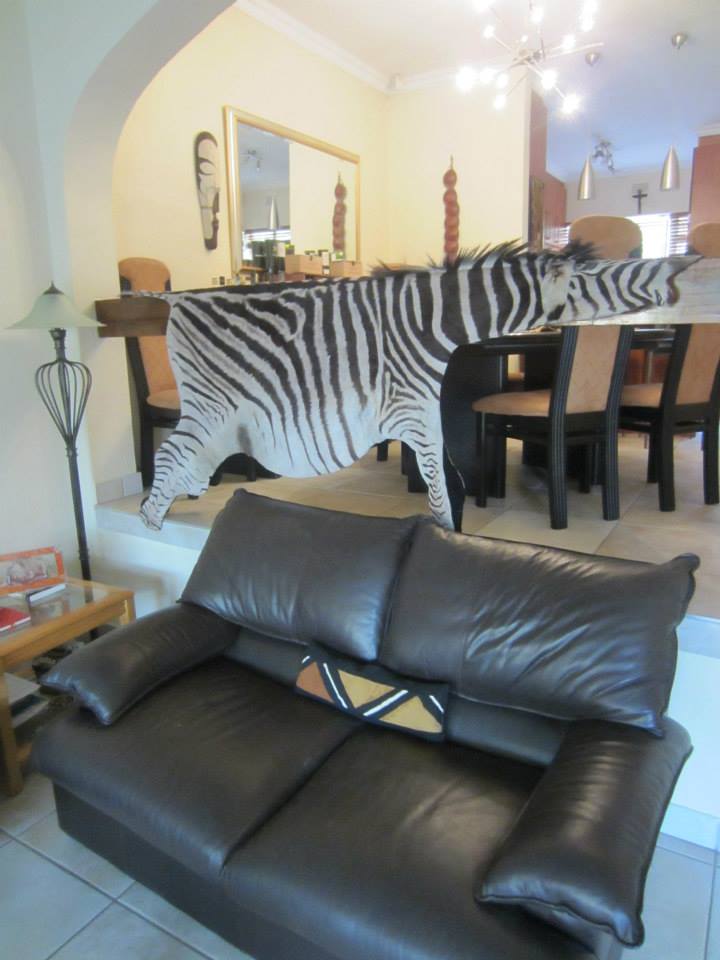 The Great Wildebeest Migration Hanging a Zebra Skin