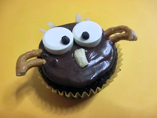Halloween themed Hoot owl pumpkin chocolate muffins or frosted cupcakes