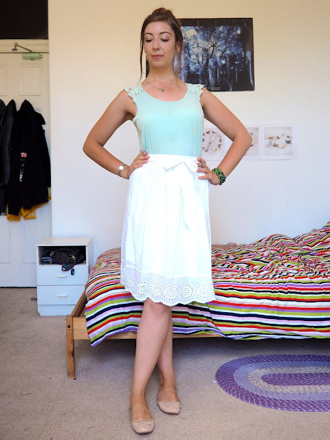 Princess Tiana Disneybound outfit of pale green lace top, long white skirt, nude flats and nature themed jewellery