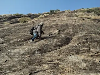 Hiker is ready for the toughest rock face at the Kabbaladurga trek