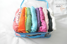 Use sturdy packing cubes to organize shirts for easy travel :: OrganizingMadeFun.com