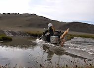 Triumph Scrambler crossing mongolian river