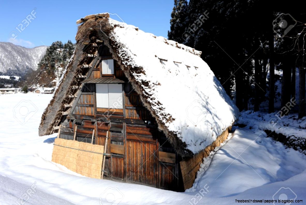 Thatched Roof House Covered In Snow Stock Photo Picture And