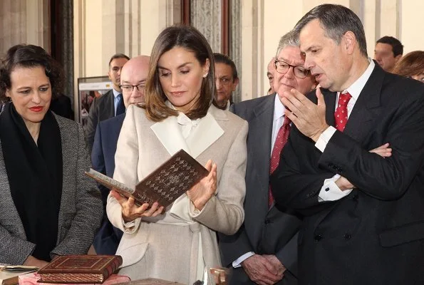 Queen Letizia carried Carolina Herrera Authenticity Card Camelot Collection Handbag and she wore Carolina Herrera wool and cashmere coat