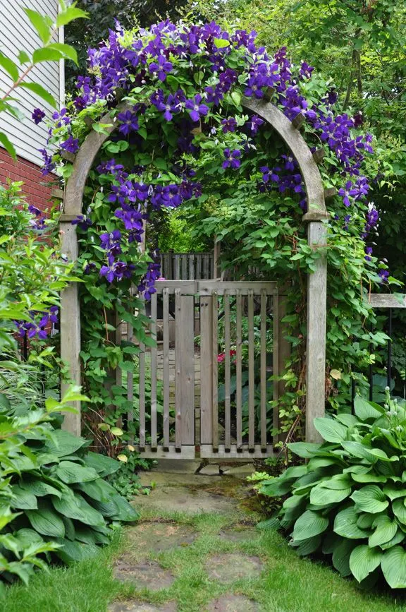 gate with curved top and flowers