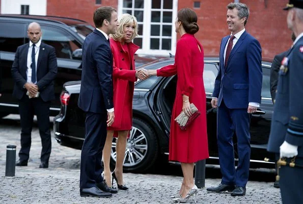Crown Princess Mary is wearing a Raquel Diniz silk dress. Crown Princess Mette-Marit wore the same dress in 2017