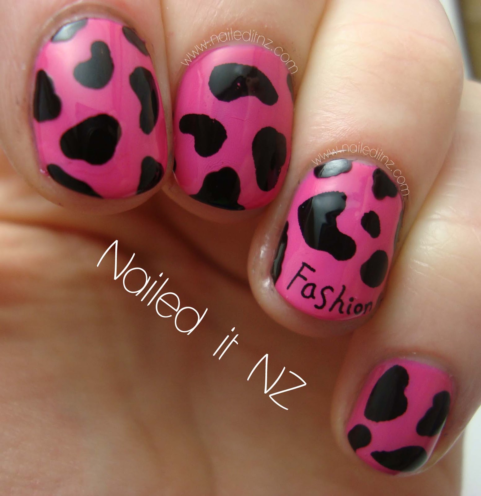 Pink and black cow print nails with a twist!