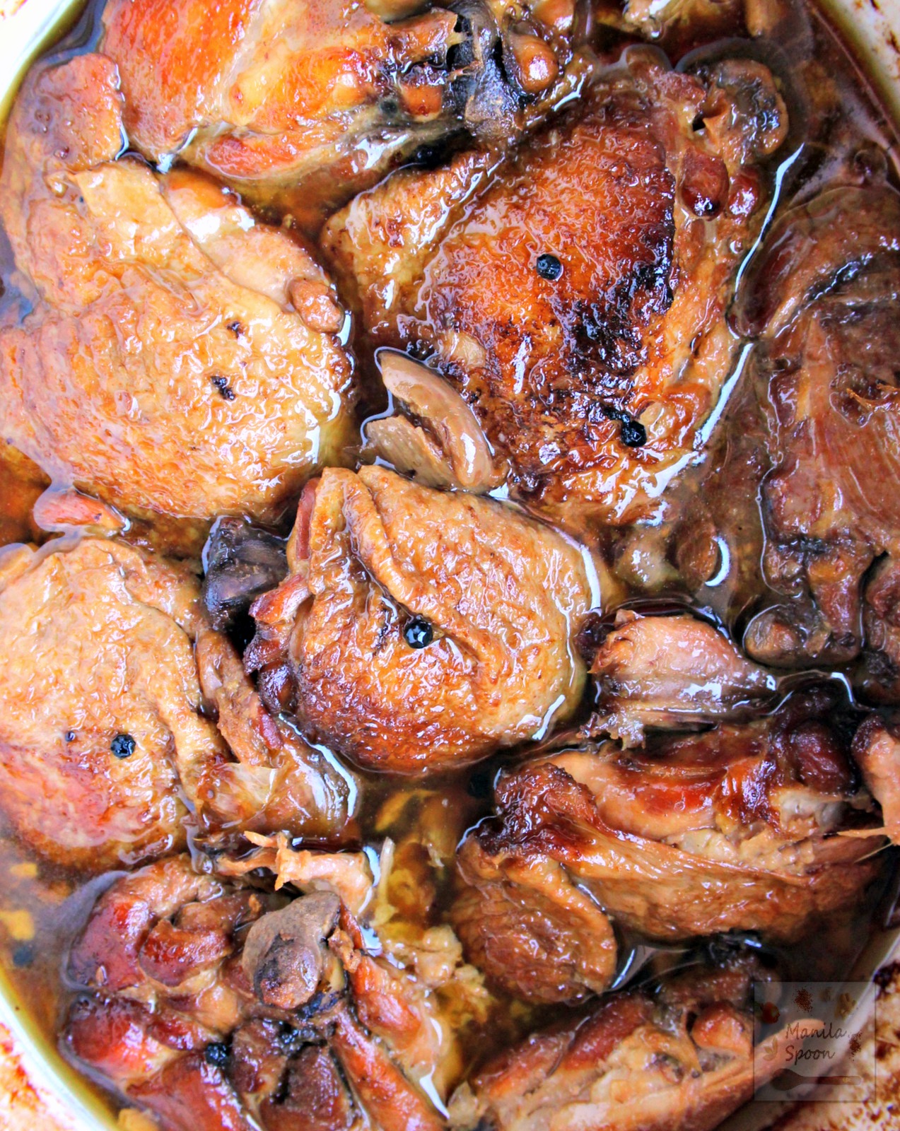 Chicken slowly braised in vinegar, soy sauce, garlic and bay leaves until fall-off-the-bone tender and DELICIOUS. This classic dish can be made a day ahead and tastes even better the next day! Slow Cooker Chicken Adobo | manilaspoon.com