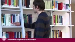 student in library student taking a book in library