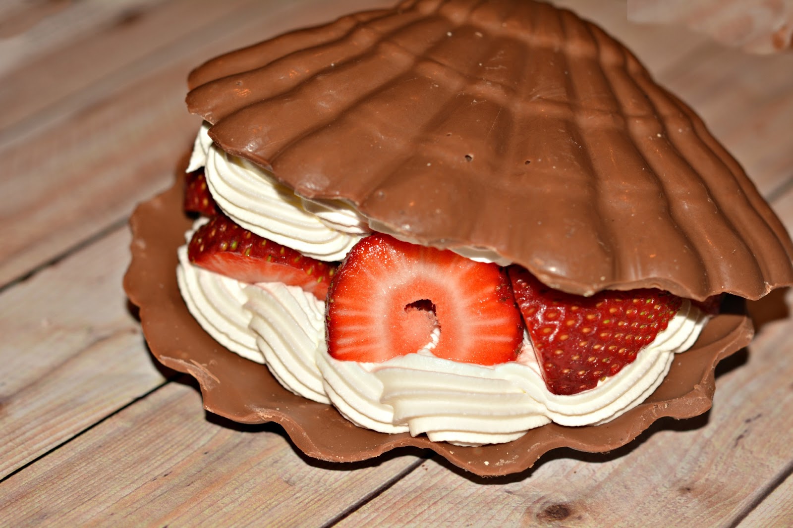 CHOCOLATE SHELL FILLED WITH STRAWBERRIES & WHIPPED CREAM Hugs and