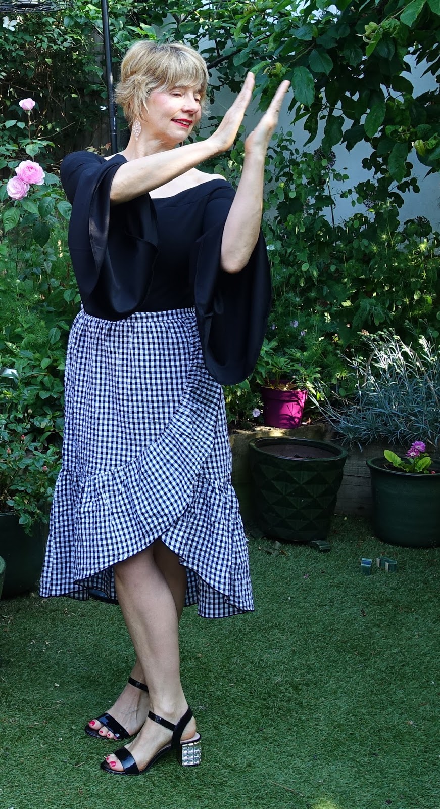Tiered gingham skirt from Mango worn with black Bardot body from Boohoo