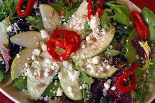 mixed greens salad with apples, roasted red peppers, feta & pine nuts