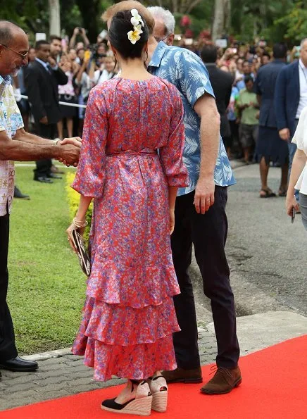 Meghan Markle wore CASTAÑER Carina canvas wedge espadrilles and Figue Frederica printed ruffle dress