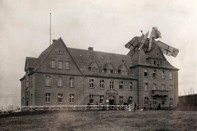 Photos of WWI Air Accident, 1918. German Friedrichshafen seaplane crashed into the peak of a large freestanding building and remains trapped in a whole in the roof. Dogfights and other stories of pilots. marchmatron.com Photos of WWI Air Accident, 1918. German Friedrichshafen seaplane crashed into the peak of a large freestanding building and remains trapped in a whole in the roof. Dogfights and other stories of pilots. marchmatron.com