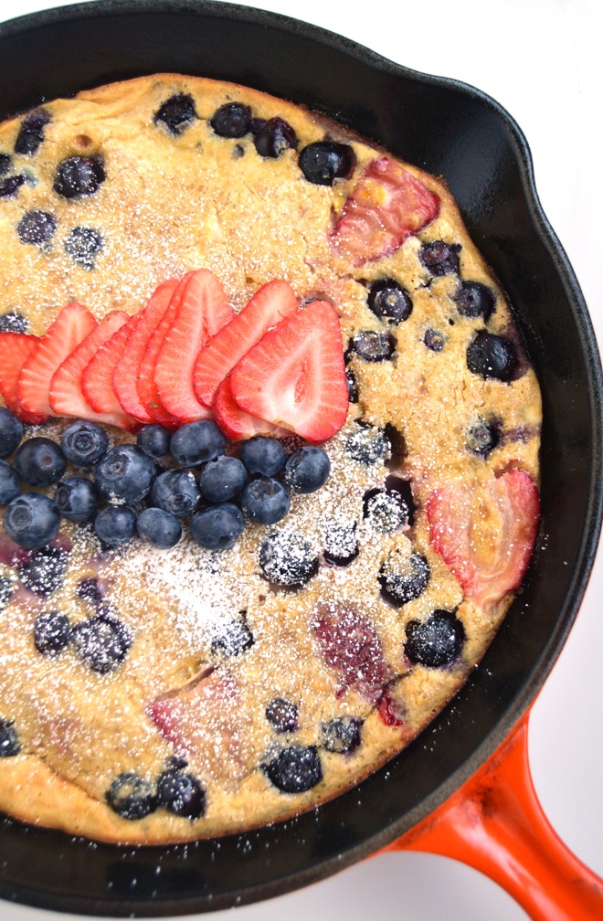 Strawberry Blueberry Dutch Baby makes the perfect breakfast or brunch dish! Made healthier with whole-wheat flour and loaded with fresh berries and ready in less than a half-hour. www.nutritionistreviews.com