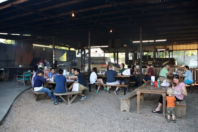The outdoor dining area with a view of the pits.