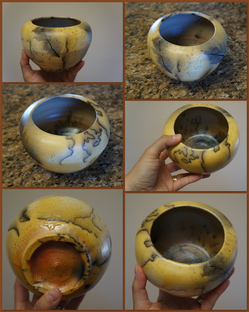 Beautiful horsehair and feather raku pottery pot.