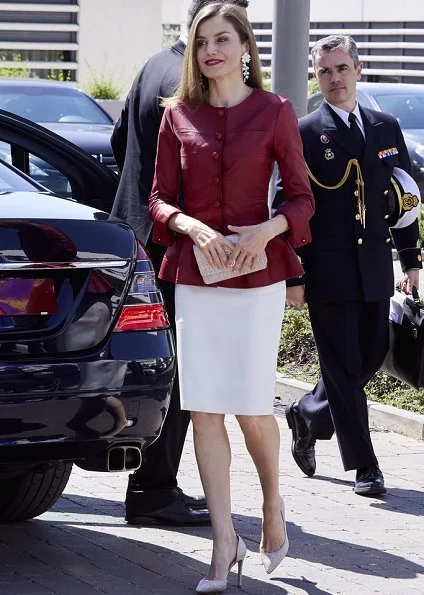 Queen Letizia wore Uterque red Leather jacket and Uterque beige pumps, Queen carried Uterque clutch bag, wore Hugo Boss skirt