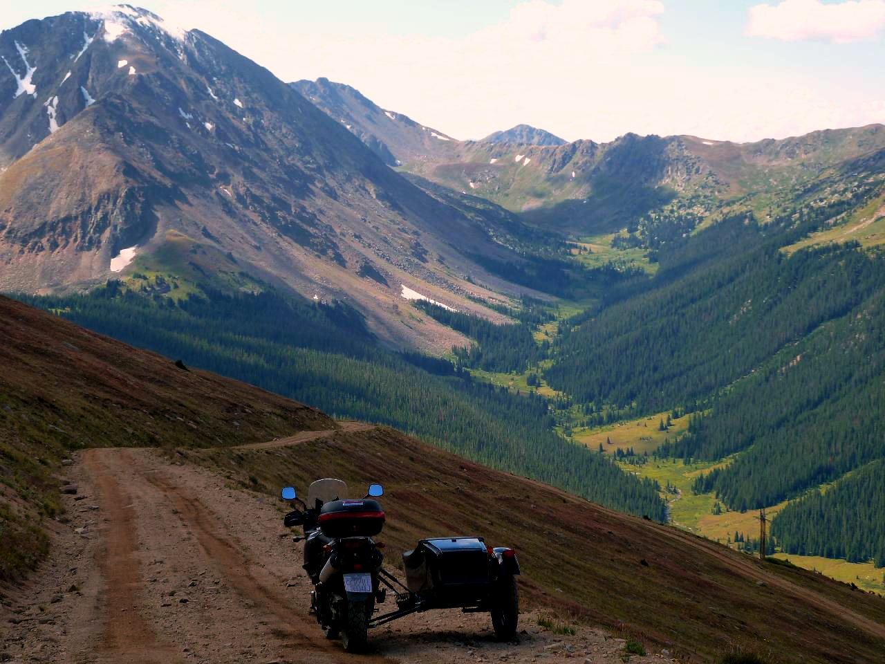 A Redleg's Rides Sidecaring to the top of Jones Pass
